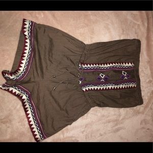 brown romper with aztec design.